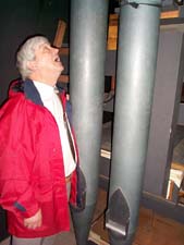 Former organist standing next to largest pipes